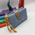 Portafoglio in ecopelle cielo con charms